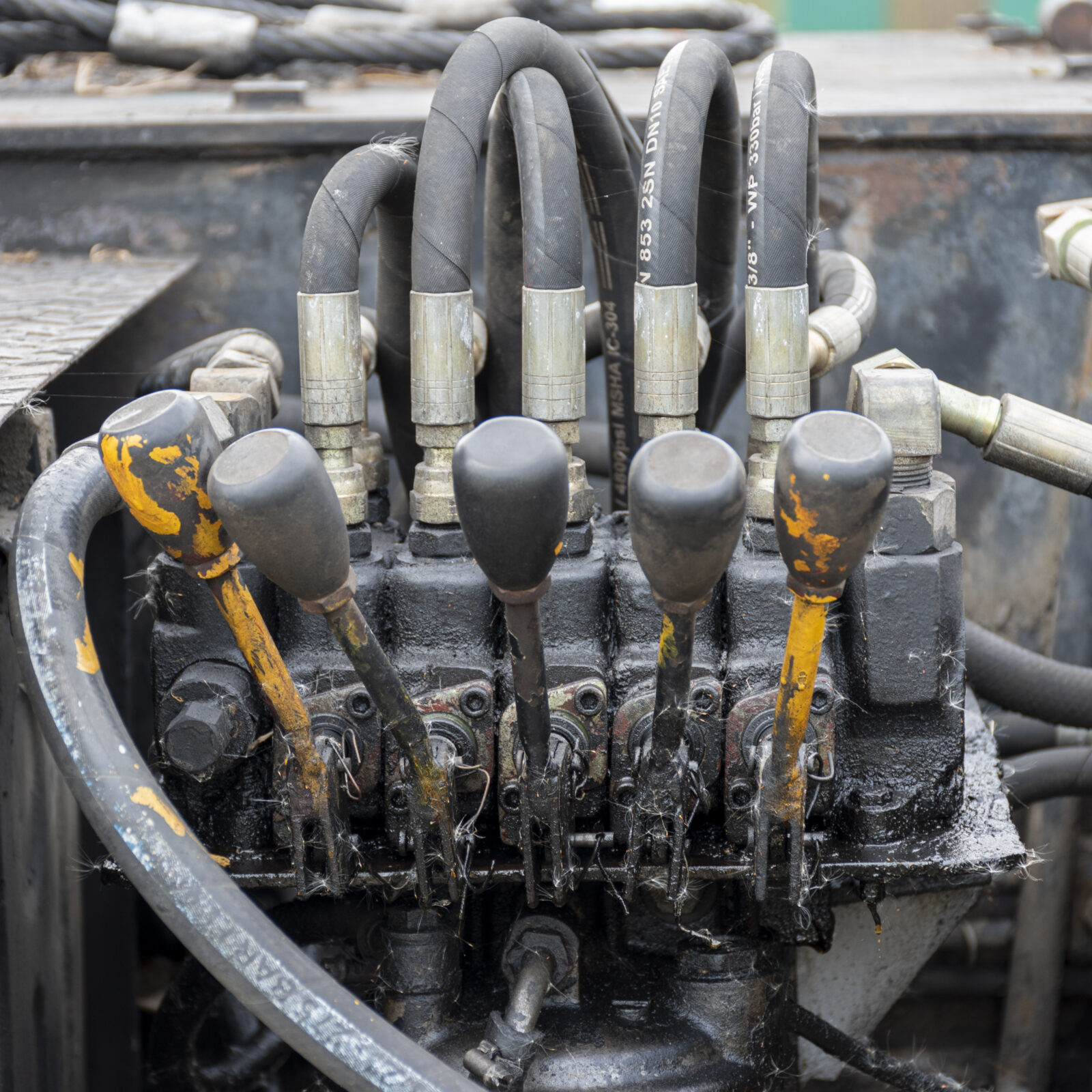 Hydraulic control levers on construction machinery. Crane control lever panel.